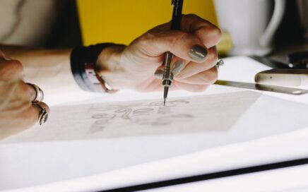 Image of hand with dark nail polish, sketching. By Kelly Sikkema.